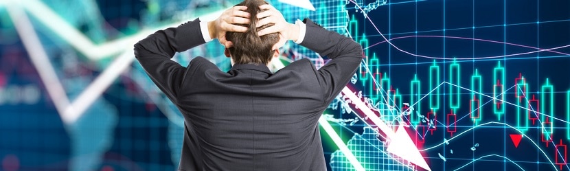  Un professionnel dépité devant un tableau de bord financier